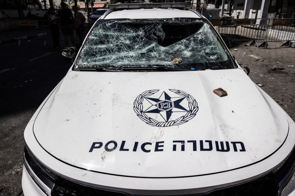 متظاهرون إيرتيريون في تل أبيب، هاجموا مركبة شرطة إسرائيلية - أحد المتظاهرين الإيرتيريين الذين تعرضوا للضرب في تل أبيب - Mustafa Alkharouf/Getty Images