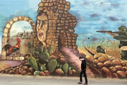 لوحة "هُنا كنعان" رسمها 25 فنّانًا على جدار في نابلس 2013