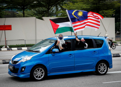  ماليزيون مؤيّدون للقضية الفلسطينية في تظاهرة في كوالالمبور - Wong Fok Loy/ Getty