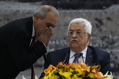 الرئيس محمود عباس ومدير جهاز المخابرات ماجد فرج - ABBAS MOMANI/Getty Images