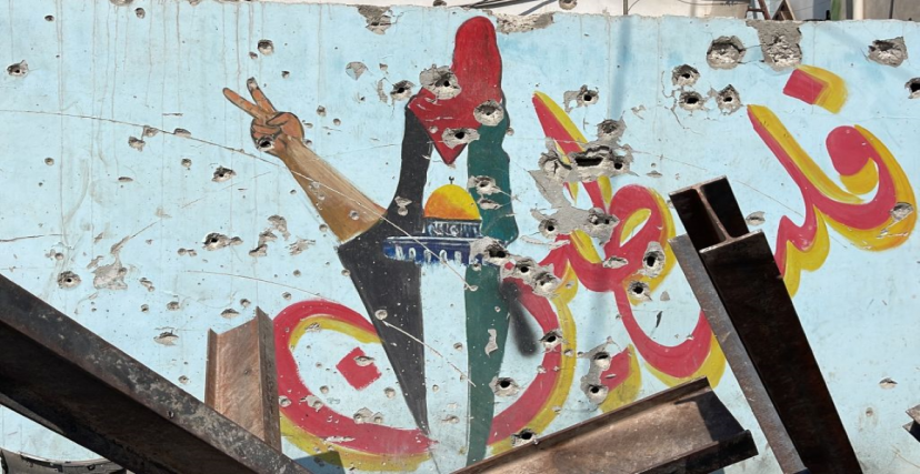 صورة أرشيفية: آثار رصاص الاحتلال في جدارية لفلسطين في مخيم جنين